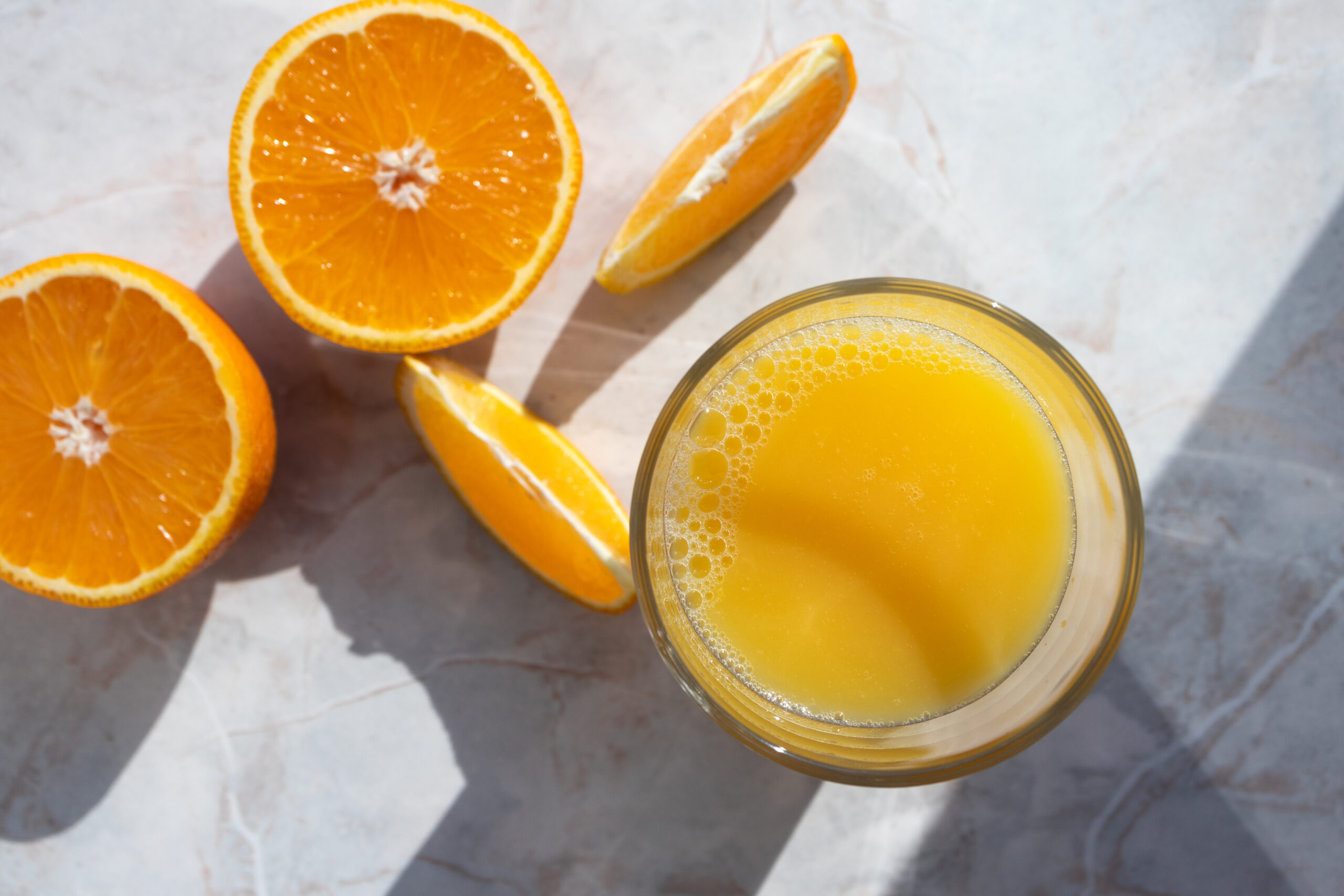 Fueling Tips: Enjoy a glass of refreshing orange juice to energize yourself before the race. Placed on a sleek marble table, this pre-race beverage provides a natural boost of fuel.