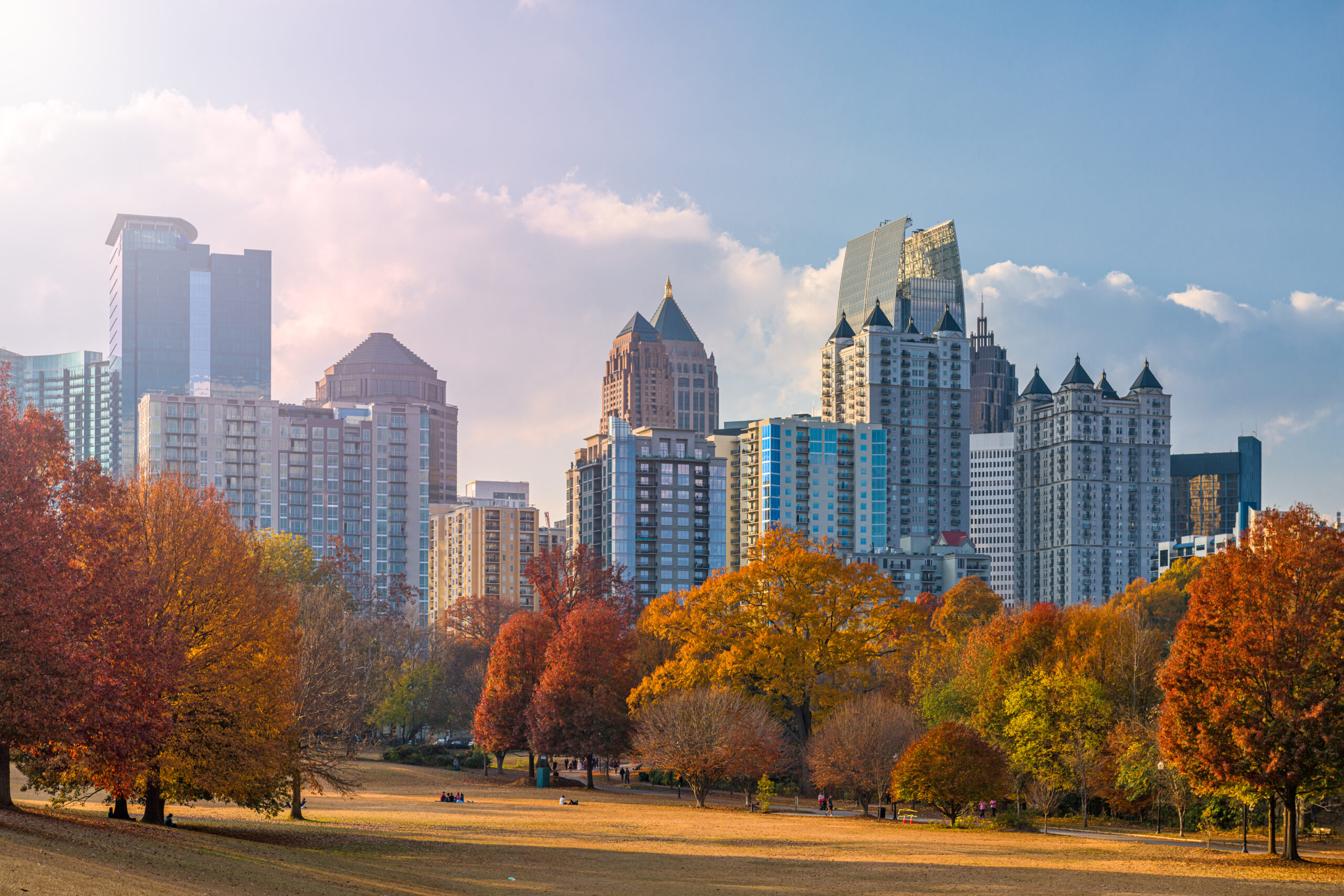 A picturesque city skyline with trees in the background, capturing the vibrant essence of Hotlanta.