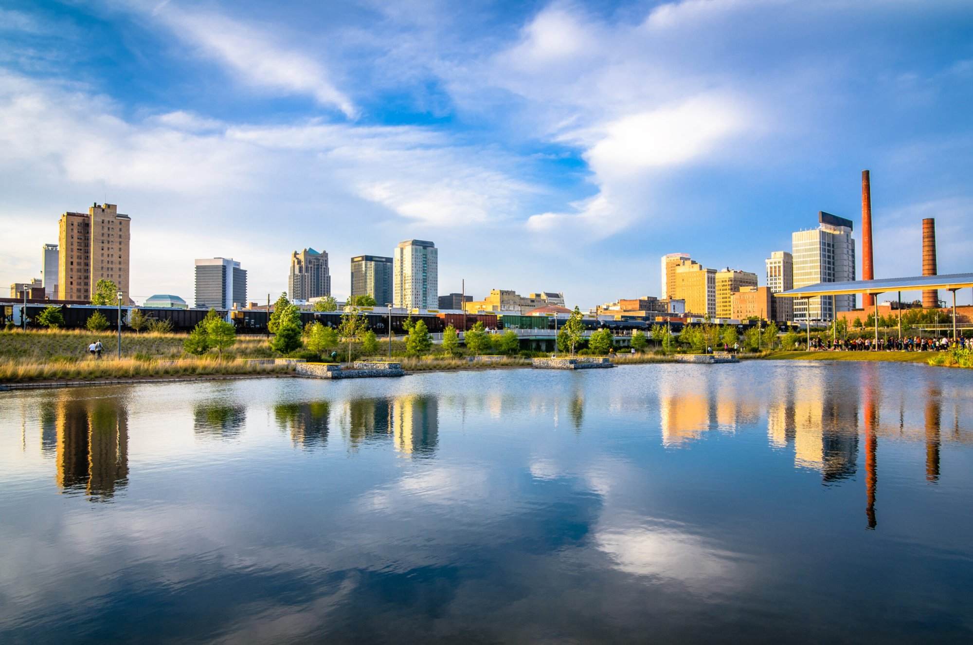 A city skyline reflected in a body of water.