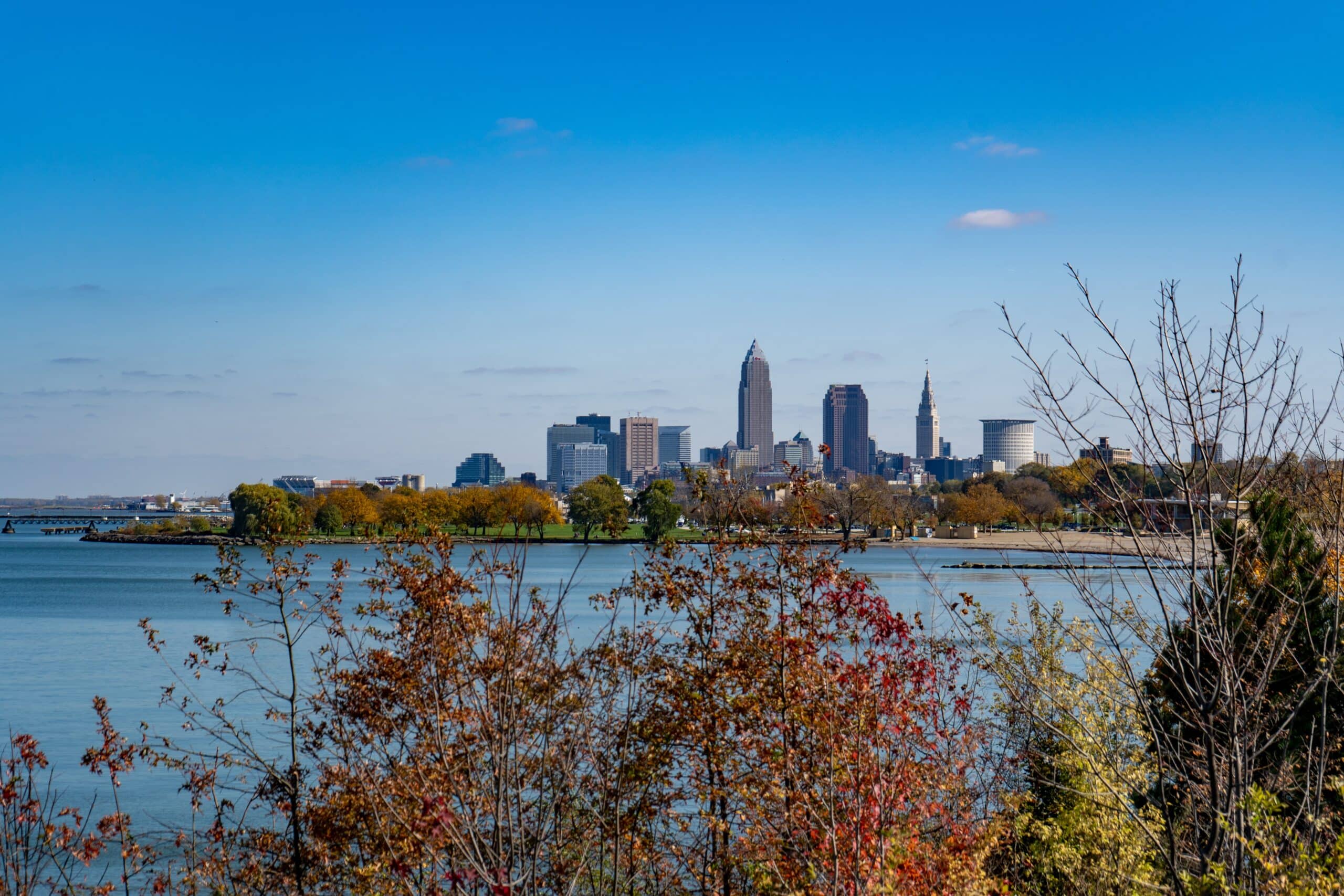 The skyline of cleveland, ohio is seen from the water.