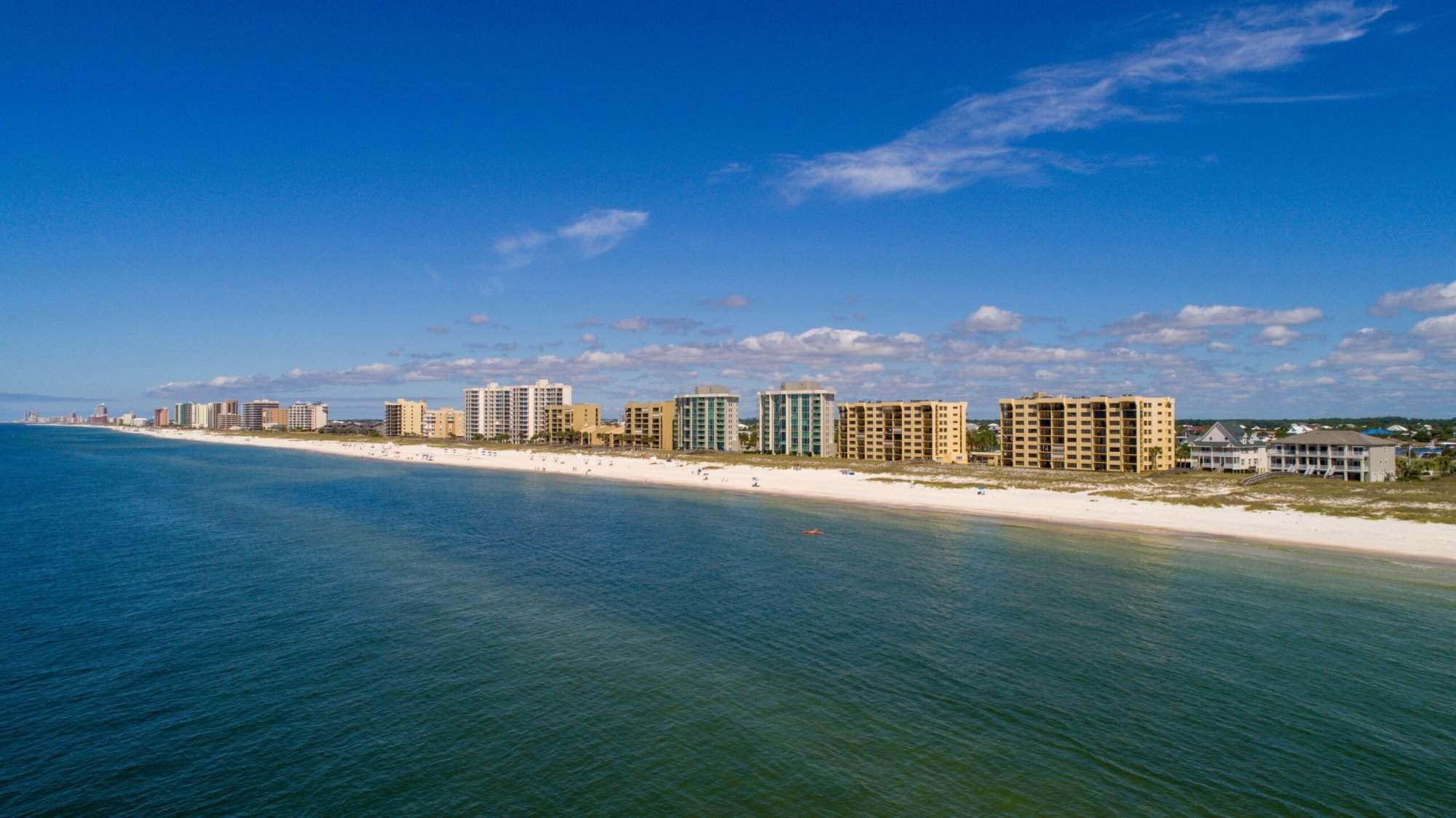 An aerial view of the beach and buildings.